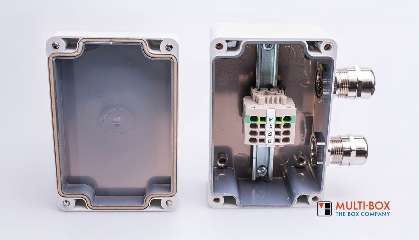 An enclosure with cable glands and a connection block, suitable for industrial EMC protection applications.